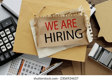 we are hiring. a lot of stationery and text on torn paper - Shutterstock ID 2306924637