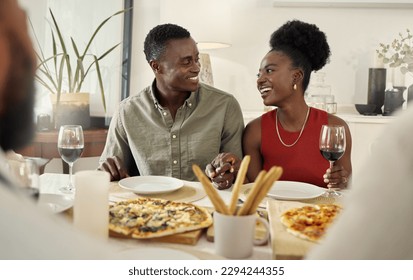 We keep thing classy with our pizza dates. Shot of an affectionate couple sitting together at a dining table. - Powered by Shutterstock