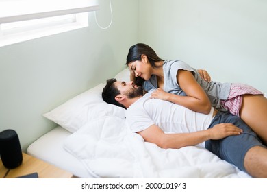 We Are In Love. Attractive Young Couple Lying In A Comfy Bed And Having A Deep Conversation About Their Romantic Relationship 