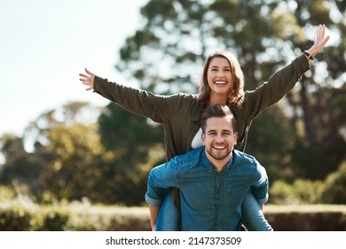 We love doing things outdoors. Cropped shot of a happy young couple spending quality time outdoors. - Powered by Shutterstock