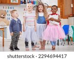 We love dressing up and playing together. Shot of a group of preschool children playing dress-up in class.