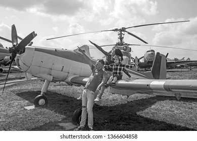 We Love To Fly. Family Couple With Son On Vacation Travel. Woman And Man With Boy Child At Helicopter. Happy Family Vacation. Air Tour And Travel. Enjoying Travelling By Air.