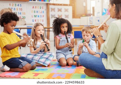 We love learning about musical instruments. Shot of children learning about musical instruments in class. - Powered by Shutterstock