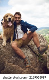 We Made It To The Top. Full Length Portrait Of A Handsome Young Man And His Dog Taking A Break During A Hike In The Mountains.