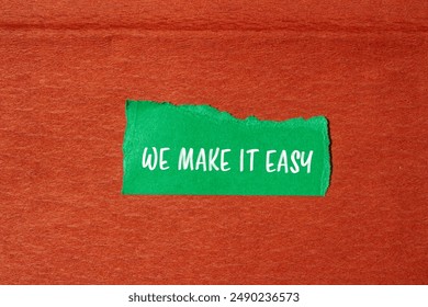 We make it easy message written on ripped torn green paper piece with brown background. Conceptual we make it easy symbol. Copy space.