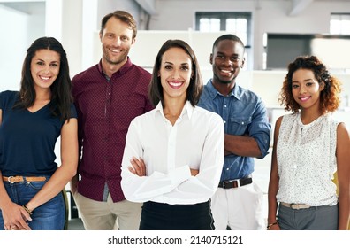 We Make A Great Team. Shot Of A Group Of Coworkers Standing In An Office.