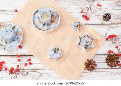 We Make Our Own Bird Food In Foil Molds From Bacon And Seeds. Winter Bird Feeder On A White Wooden Background. View From Above.