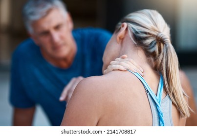 We Need Get That Checked Out Asap Honey. Shot Of A Mature Woman Holding Her Neck In Pain After An Intense Workout Session With Her Husband.