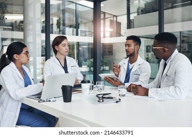 We need to go over what happened. Shot of a group of doctors having a meeting together. - Powered by Shutterstock