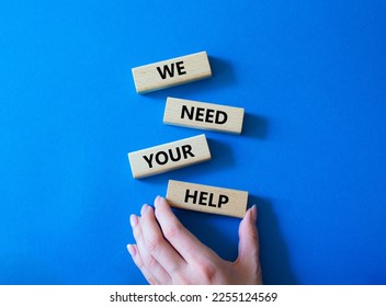 We need your help symbol. Wooden blocks with words We need your help. Businessman hand. Beautiful blue background. Business and We need your help concept. Copy space. - Shutterstock ID 2255124569