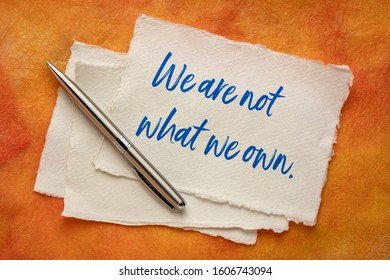 We Are Not What We Own - Inspirational Handwriting On A Handmade Paper, Simplicity, Minimalism, Lifestyle And Anti Consumerism Concept