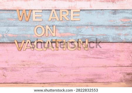 we are on vacation write on rustical wooden background 