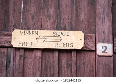 We sell coffins, low price (Vindem sicrie, pret redus). Coffins for sale ad. - Shutterstock ID 1982441135