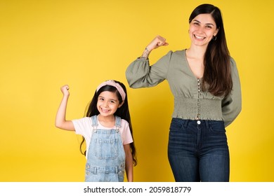 We Are Strong. Portrait Of A Powerful Hispanic Family Feeling Happy While Staying Strong Together 