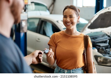 We take care of cars and the people who drive them. Shot of a woman receiving her car keys.