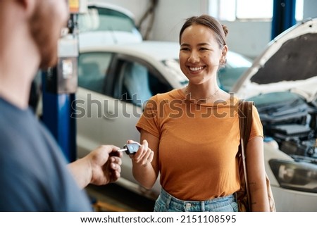 We take care of cars and the people who drive them. Shot of a woman receiving her car keys.