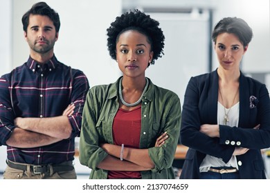 We Take Pride In Our Teams Work Ethic. Portrait Of A Group Of Businesspeople Standing With Their Arms Folded In A Modern Office.