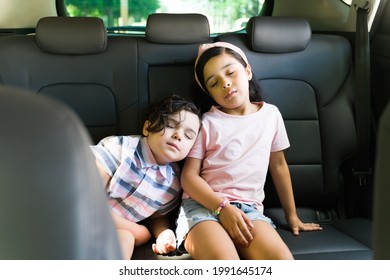 We Are So Tired. Sleepy Little Brother And Sister Sleeping In The Back Of The Car Together After Playing Outside A Lot 