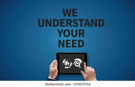 WE UNDERSTAND YOUR NEEDS, on the tablet pc screen held by businessman hands - online, top view