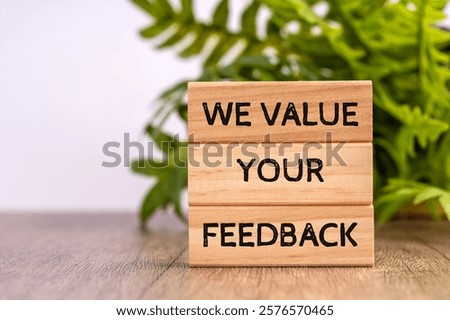 we value your feedback text in Wood block 