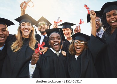 We worked hard to get here. Shot of a group of cheerful university students on graduation day.