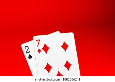 Weak Poker Hand. Playing Cards On A Red Background. Losing, Bad Luck. Loss Of Money.