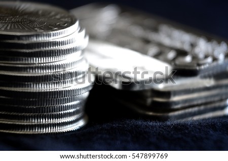 Wealth represented by silver coins and bars money