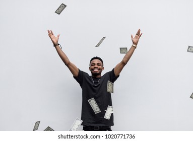 A wealthy African man throwing away his money
