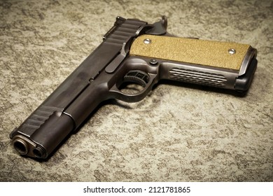 Weapon, pistol caliber 45 acp, close-up photo.