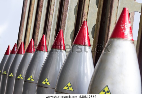 Weapons of mass destruction. Missiles with\
warheads, stand in a row, ready to launch. Nuclear weapons,\
chemical weapons. War, shelling, North\
Korea.