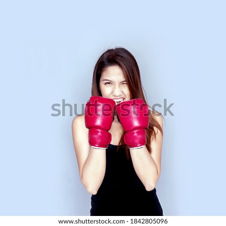 wear boxing glove on asian woman model hand to join  exercise with boxing on isolated background include path