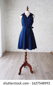Women’s wear Navy dress isolated shirt dress close up on sewing dress form summer vintage outfit fashion design clothing store display on mannequin style blogger dark blue party bridesmaid wedding 