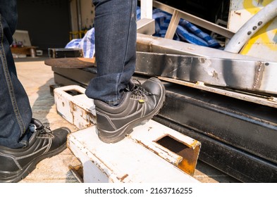 Wear safety shoes to ensure safety at work. construction workers wear safety shoes. concept. Construction workers work on the stairs - Shutterstock ID 2163716255