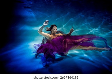 wearing in a lavender dress leggy lass is undersea in the swimming pool
