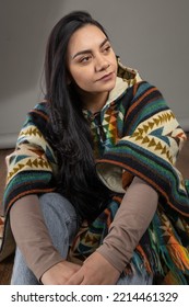 Wearing Traditional Colorful Poncho A Young Latin Woman With Black Hair, Natural Beauty And Fashion From Latin American Culture In Studio, Female Model Smiling