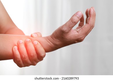 Wearing wrist support to reduce movement can increase injury. Cold compresses to reduce inflammation. - Shutterstock ID 2160289793