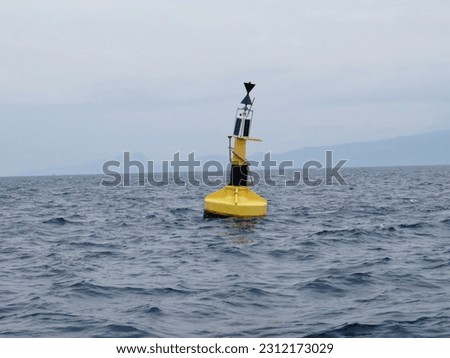 Weather buoy. Oceanographic buoy on the surface of the sea.                              