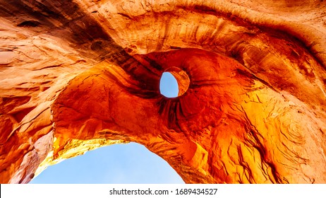 The weather stained ceiling the Big Hogan arch, a large arch in Monument Valley Navajo Tribal Park on the Utah and Arizona border, USA. It is shaped like an Eagle's Head with the hole forming the Eye.