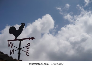 Weather Vane Rooster with cloudy sky - Powered by Shutterstock