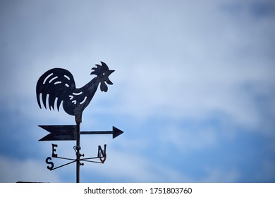 a weather vane in the sky