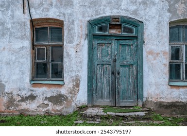 Weathered blue door and vintage window on abandoned building with rustic charm - Powered by Shutterstock