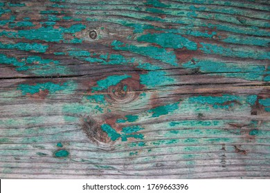 Weathered blue wooden background texture. Shabby wood teal or turquoise green painted. Vintage beach wood backdrop. Shabby decrepit wooden boards. Wood lamellas. Blue rough painted planks surface.