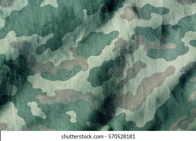 Weathered camouflage cloth texture. Abstract background and texture for design