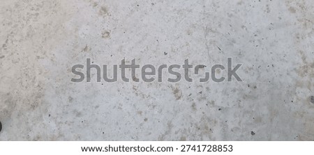 Weathered Concrete Surface: A top-down view of a stained and worn concrete floor.