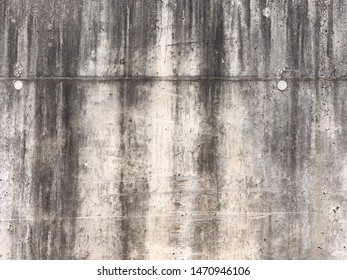 Weathered Concrete Wall Background. 
Dark Stains From Water Dripping Down