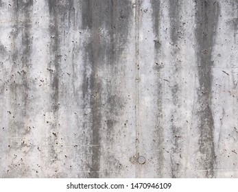 Weathered Concrete Wall Background. 
Dark Stains From Water Dripping Down