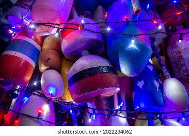 weathered fishing buoys with Christmas lights. beautiful holiday background