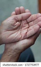 Weathered Hands In Pose Of Charity