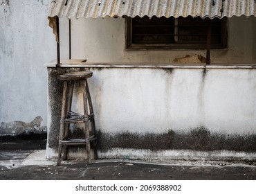 Weathered Old Bar Stool On The Rooftop Of A Residential Building