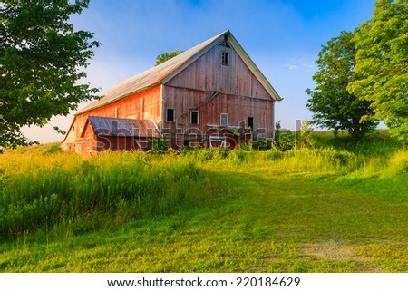 Weathered old red barn in a rural setting, Stowe, Vermont, USA